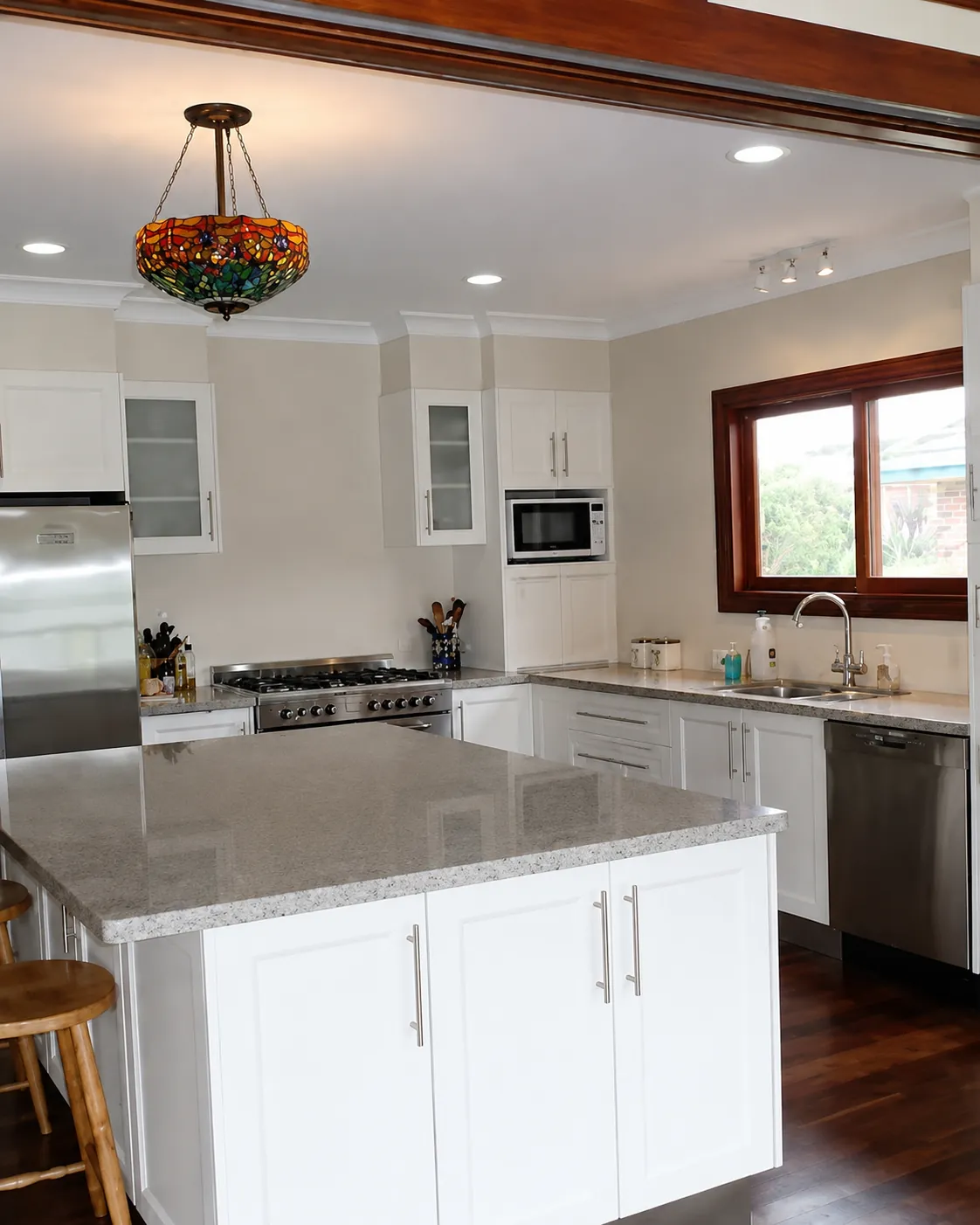 Renovated kitchen by DAMAK Builders